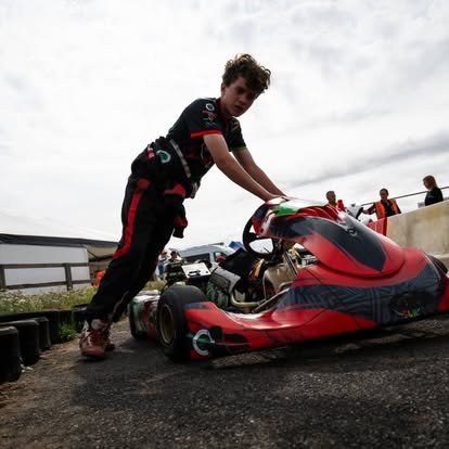 Pushing the red TLR kart out in the paddock